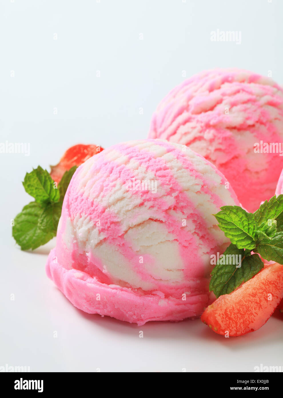 Scoops of ice cream with fresh strawberries Stock Photo