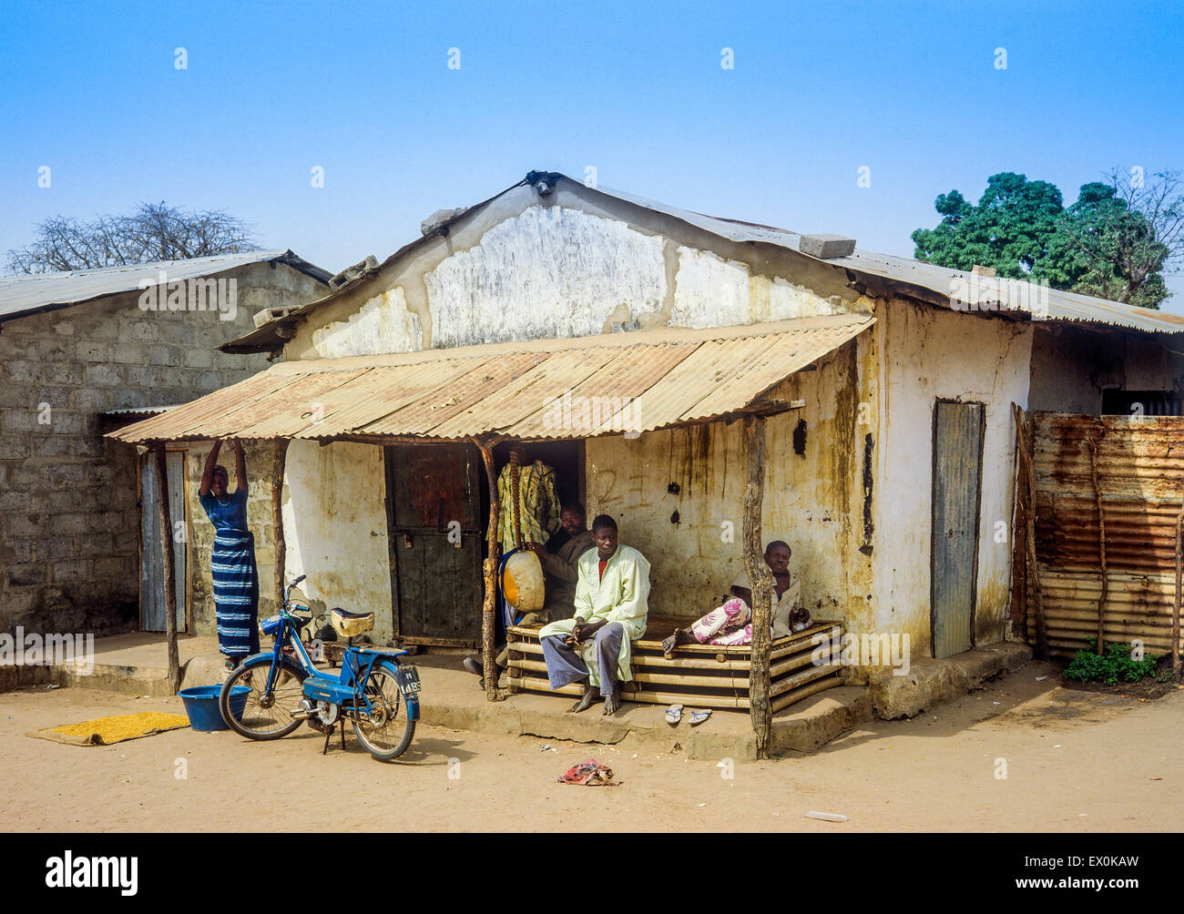 People in front of their house, Juffureh village, Gambia, West Africa Stock Photo