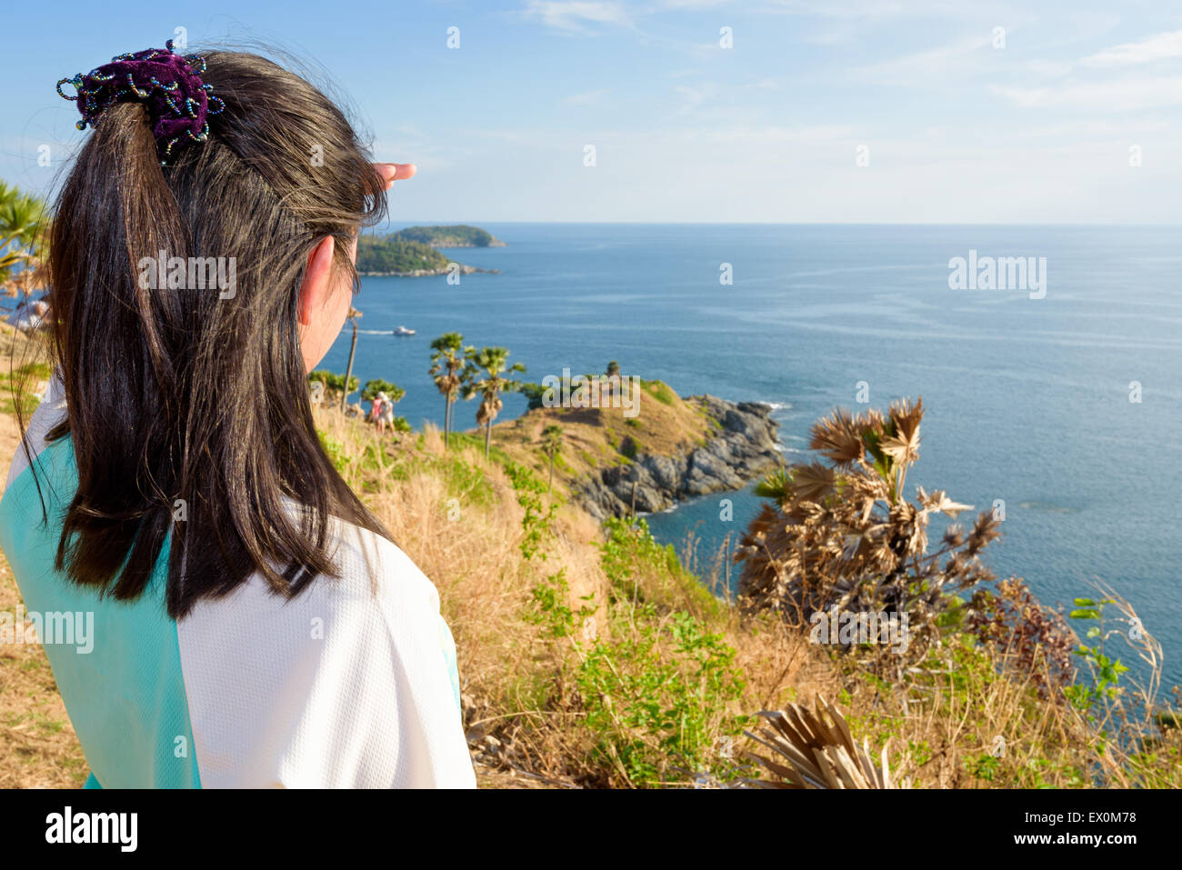Back of the women tourist looking at beautiful nature sea and island with a happy on the mountain viewpoint at Laem Phromthep Ca Stock Photo