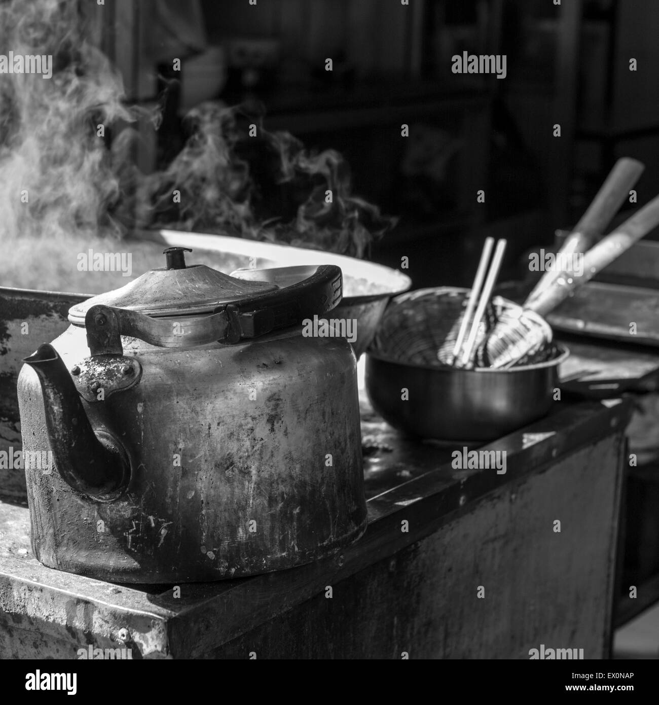 Steaming pot and teapot at food stand in Muslim Market, Xi'an, China Stock Photo