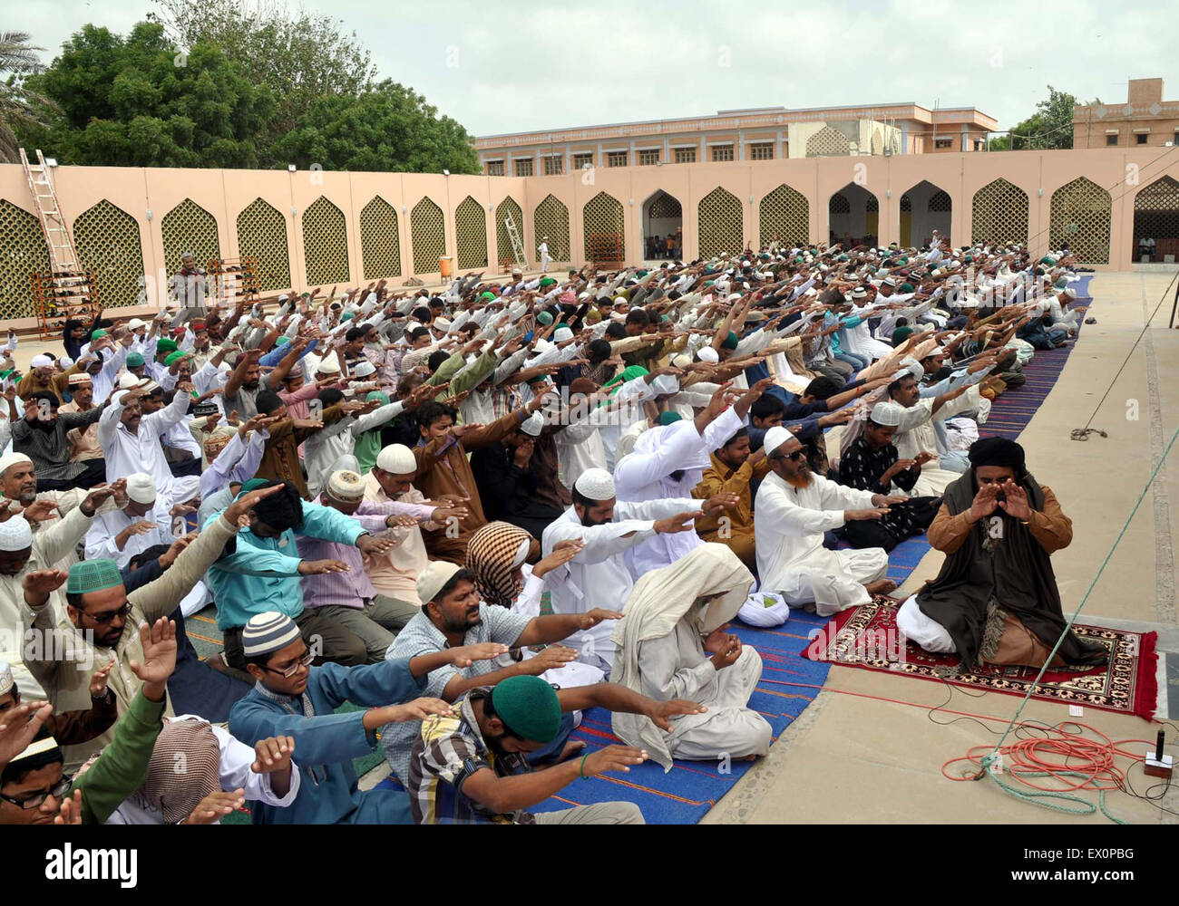 Muslims offering pray for rain in Karachi after Salat-e-Jumma on third Friday during Holy month of Ramzan-ul-Mubarak, at Alamgir Mosque of Landhi area on July 03, 2015. Images/Alamy Live News Stock Photo