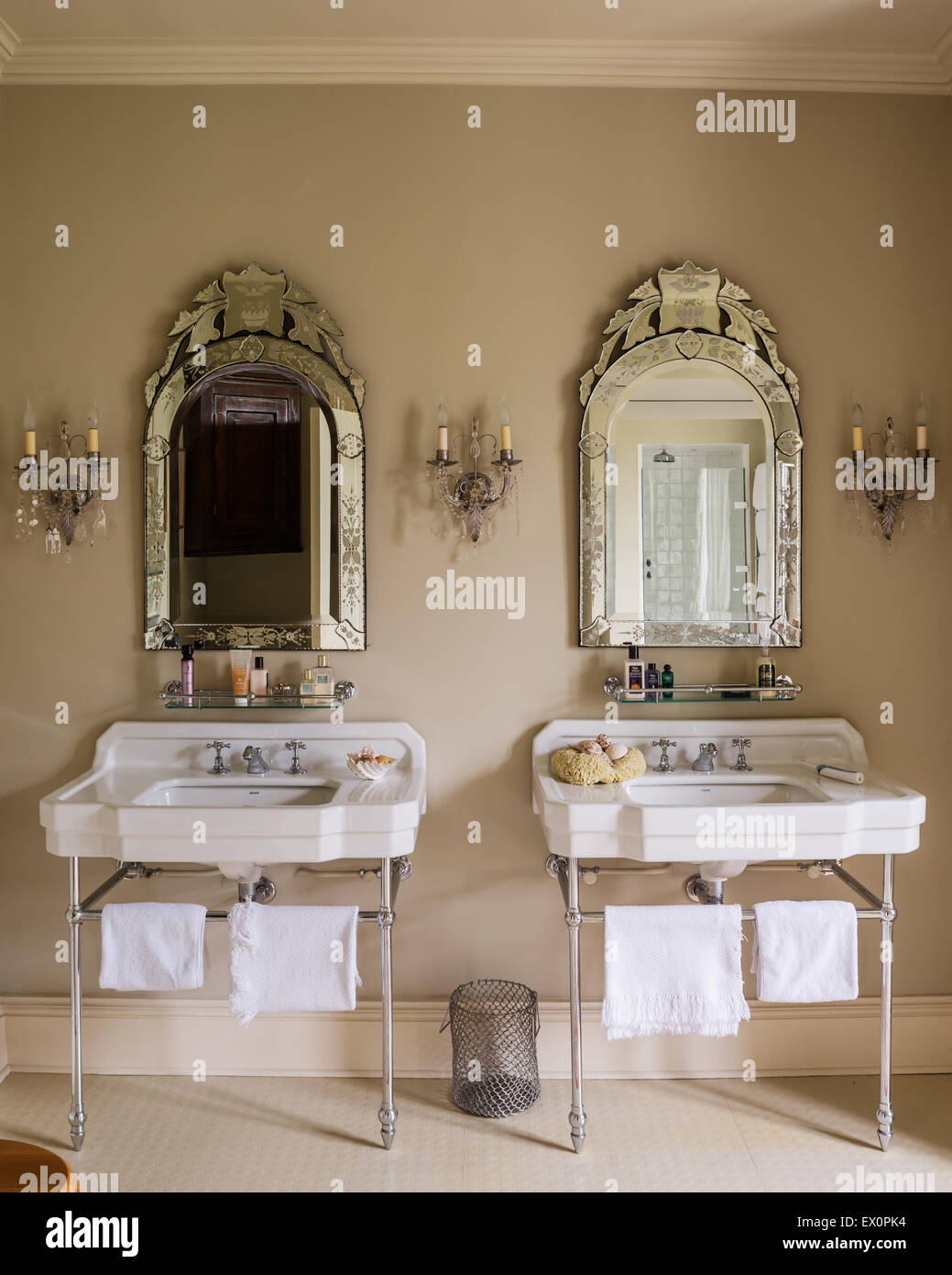 Matching basins from Cesame with glass framed mirrors from Christopher Wray Stock Photo