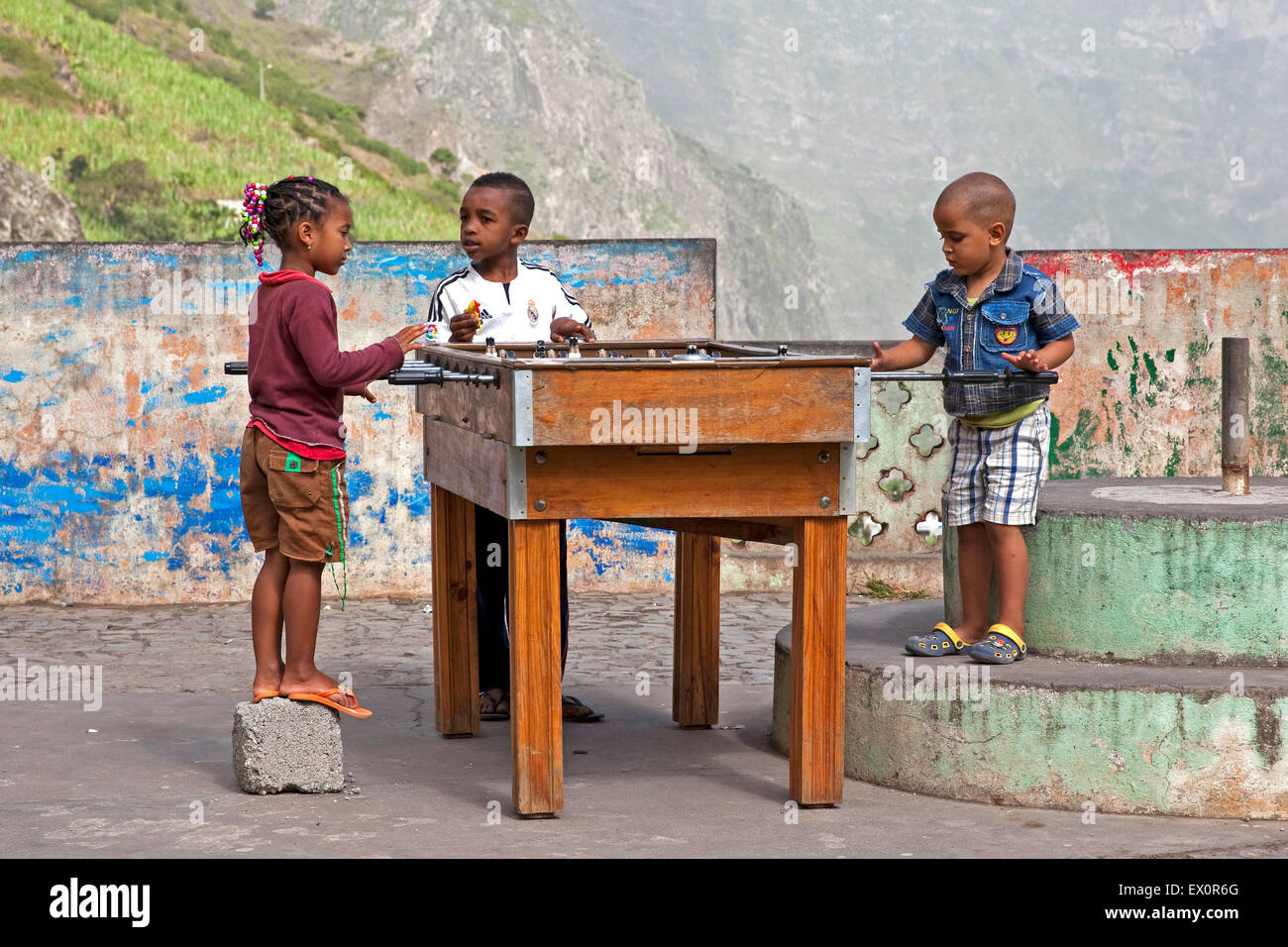 Creole children playing table football / kicker on the island Santo Antão, Cape Verde / Cabo Verde, Western Africa Stock Photo