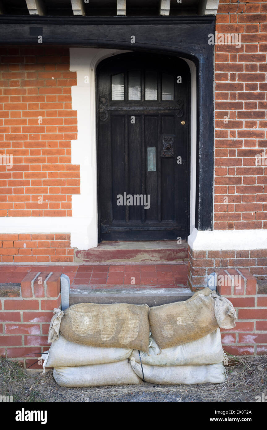 Sandbags placed at the front door of a seaside properly Stock Photo Alamy