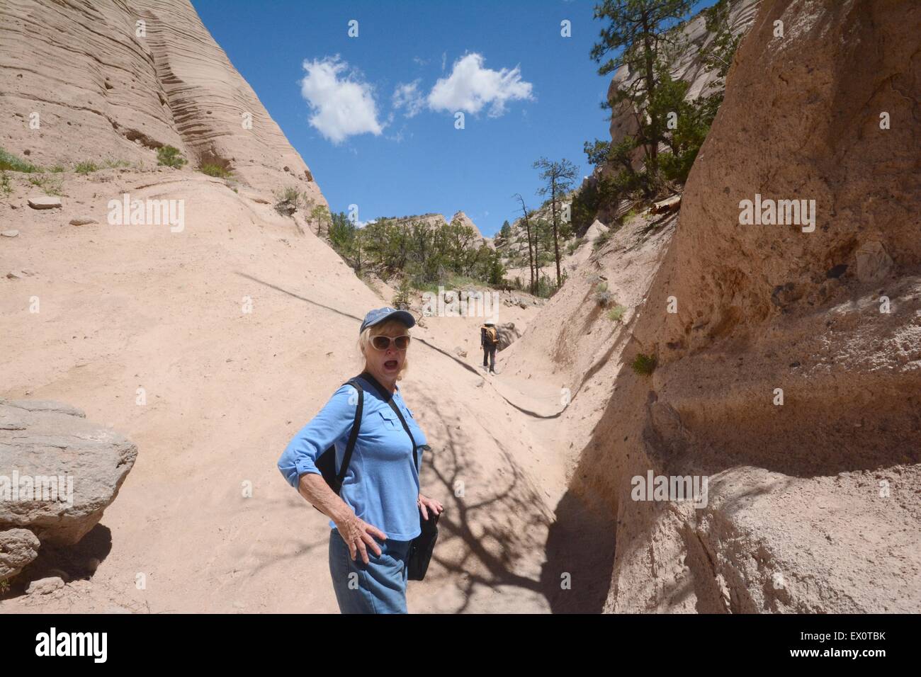 My 85 year old sister looking back down trail at Kasha-Katuwe Tent Rocks National Monument New Mexico - USA Stock Photo