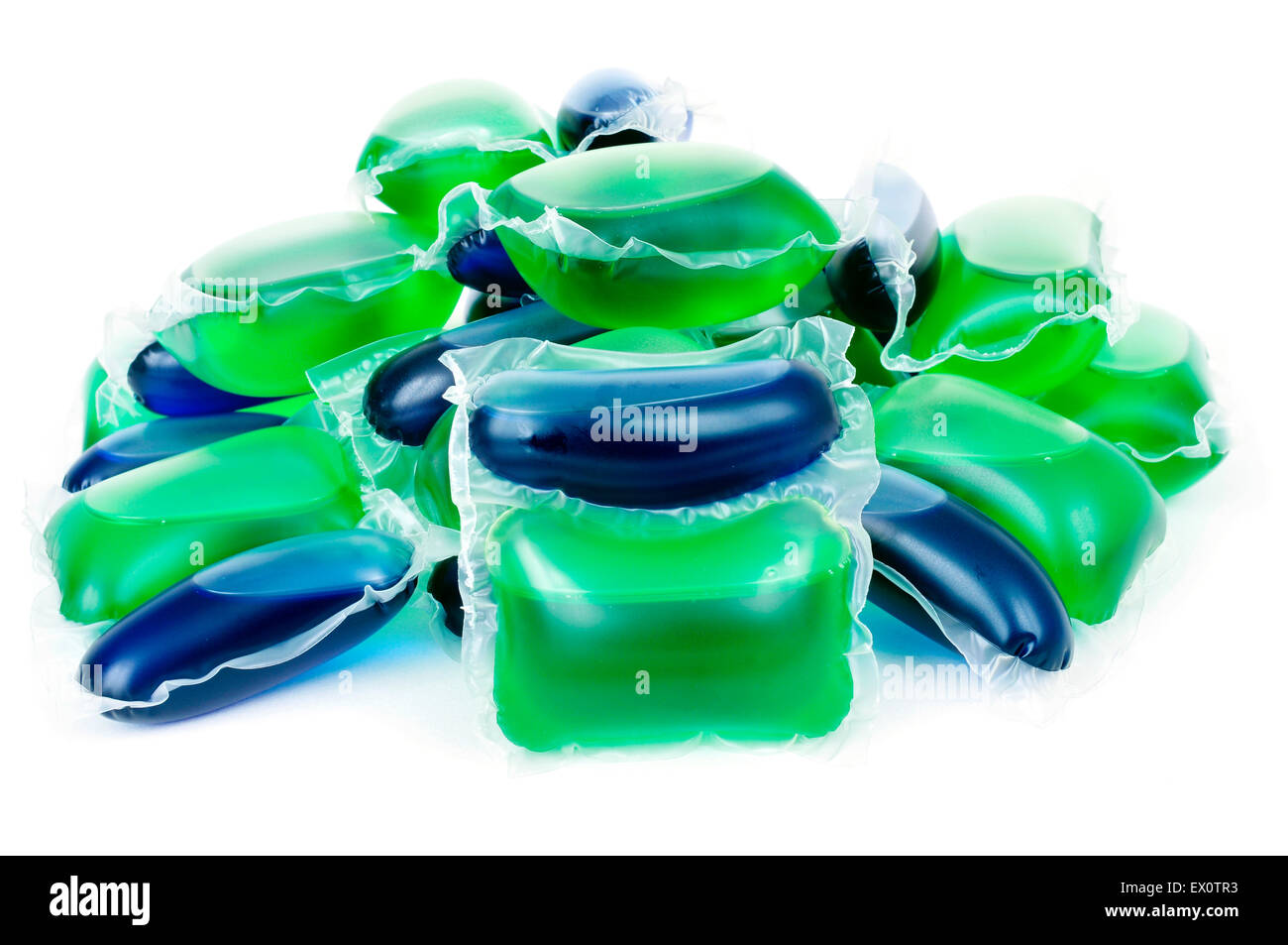 closeup of a pile of liquid laundry detergent sachets on a white background Stock Photo