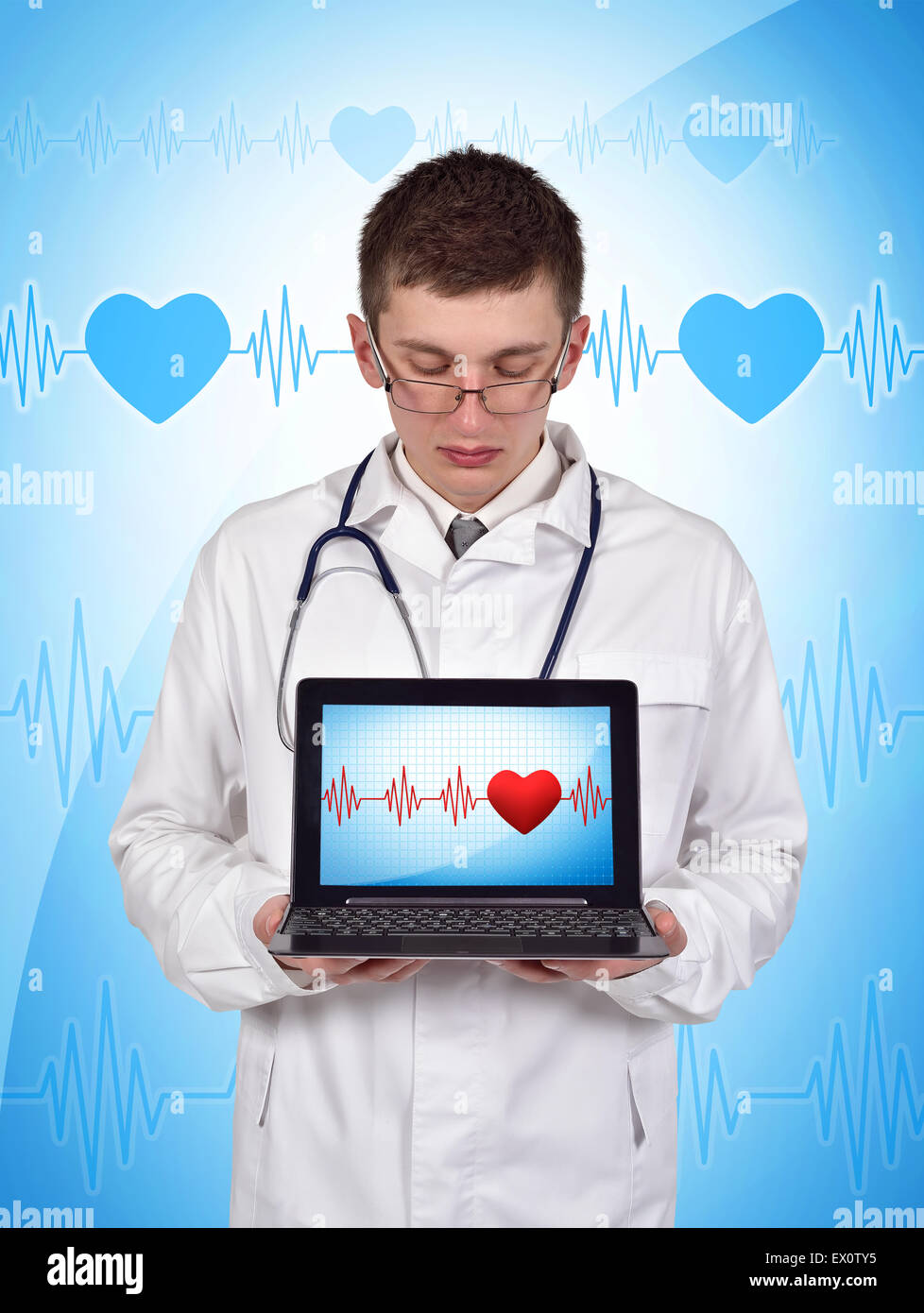 young doctor holding laptop with pulse symbol on screen Stock Photo - Alamy
