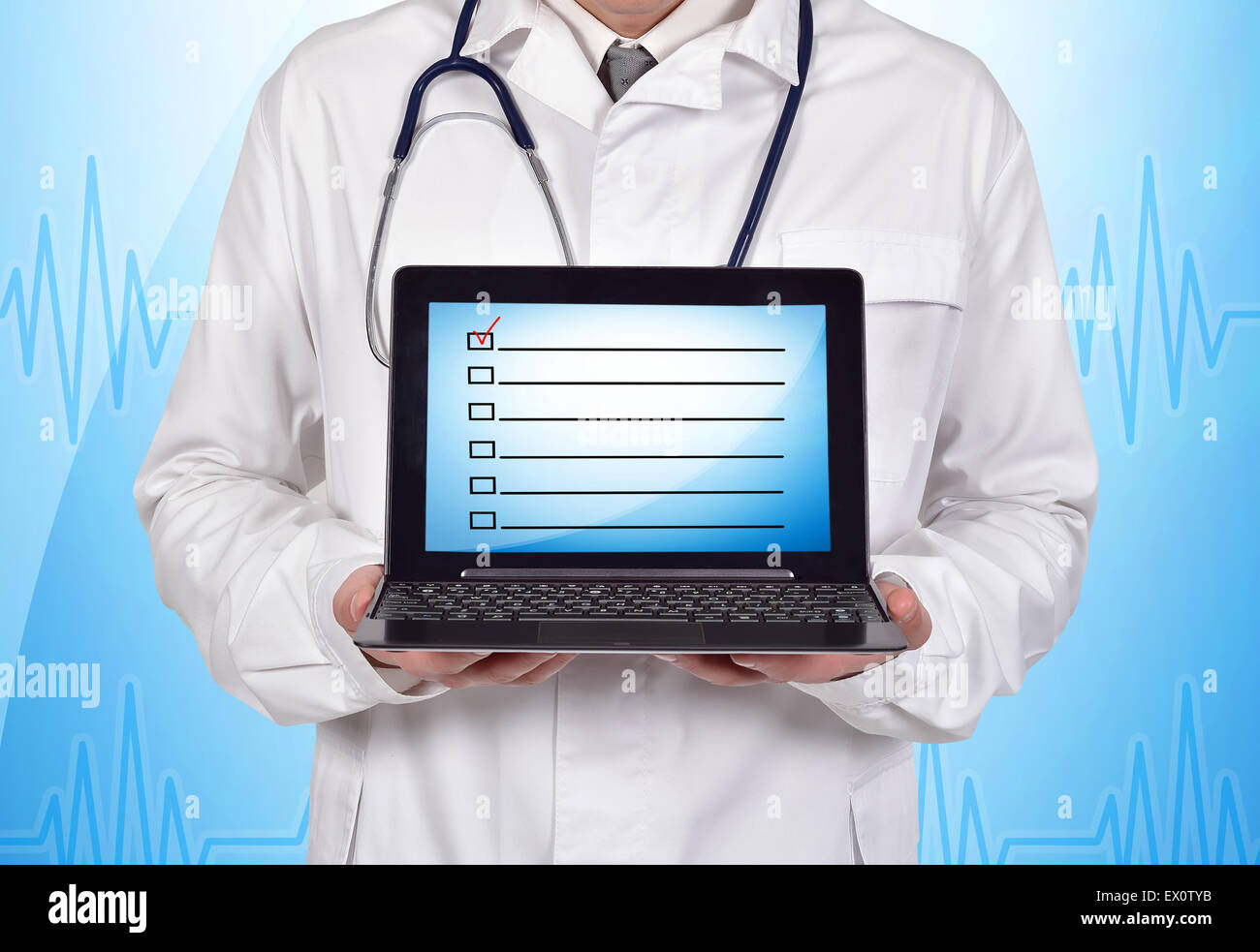 doctor holding notebook with application form on screen Stock Photo