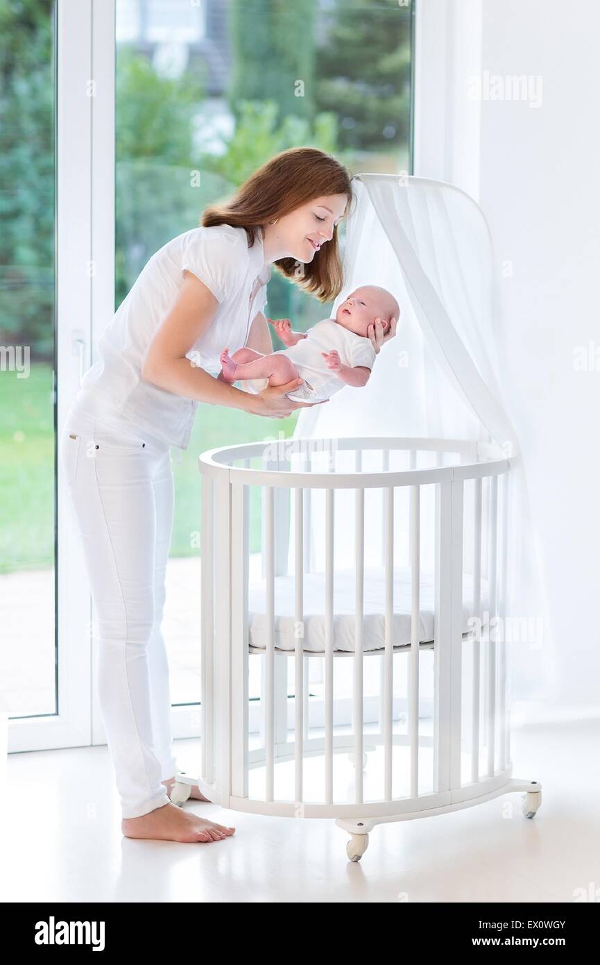 baby crib next to window