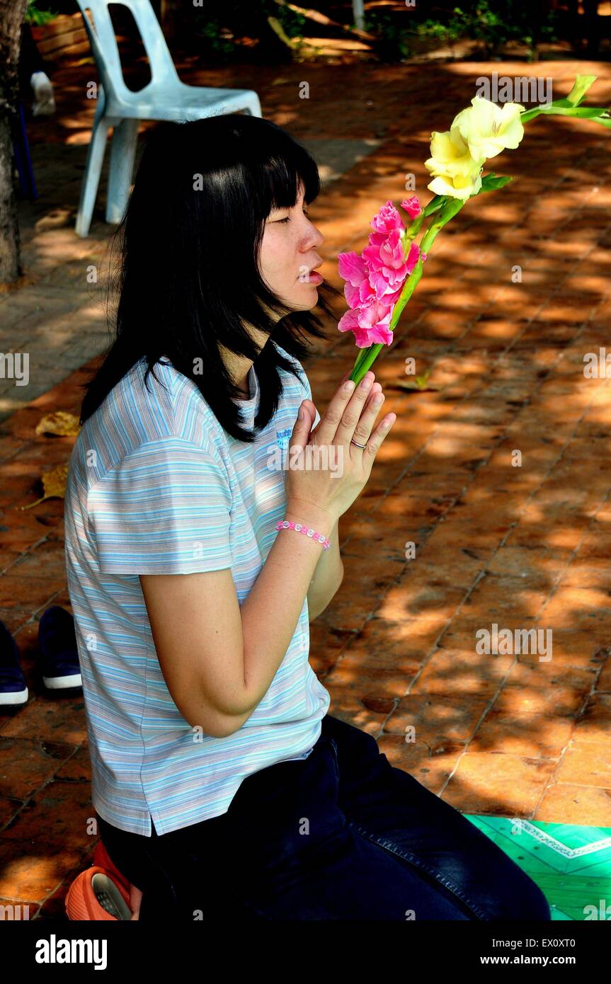 Woman kneeling in prayer hi-res stock photography and images - Alamy