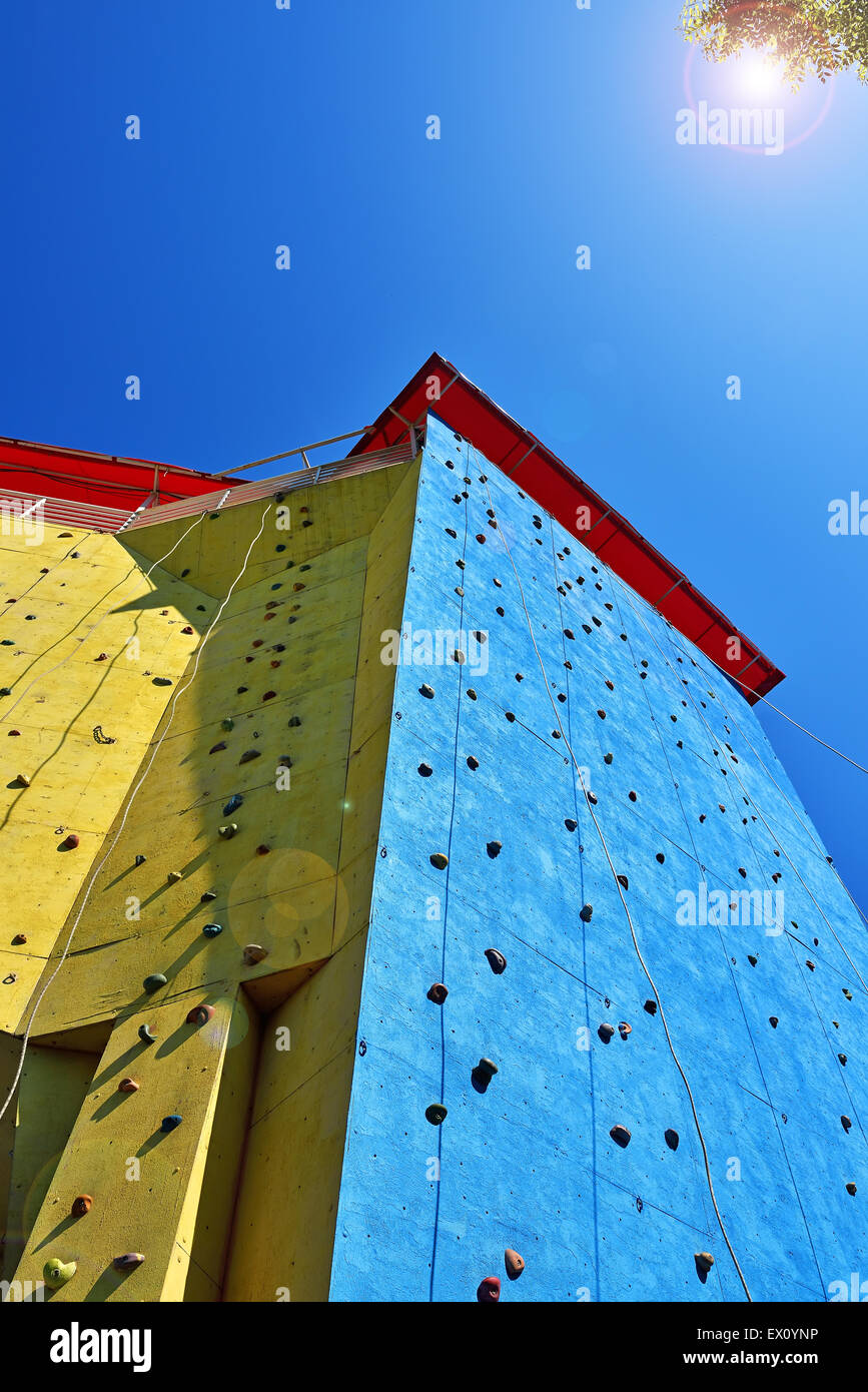 climbing wall for practicing with rope ans blue sky Stock Photo - Alamy