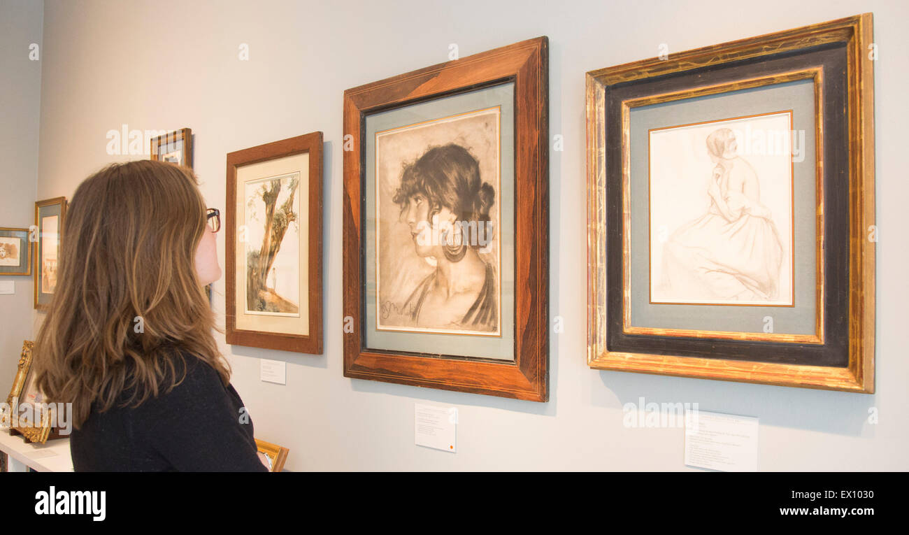 Stephen Ongpin Fine Art. Head of a Young Woman in Profile (Annunziata Cirmigniani) by Francesco Paolo Michetti and A Seated Young Woman Plaiting her Hair, Seen from behind and looking in a mirror by Edgar Degas. London Art Week 2015 celebrates the exceptional riches and unparalleled expertise available within the galleries of Mayfair and St. James’s. Over 40 leading art galleries and three auction houses, including a selection of international galleries, will showcase an impressive array of paintings, drawings, sculpture, and works of art, from antiquity to the 20th century from 3 to 10 July 2 Stock Photo