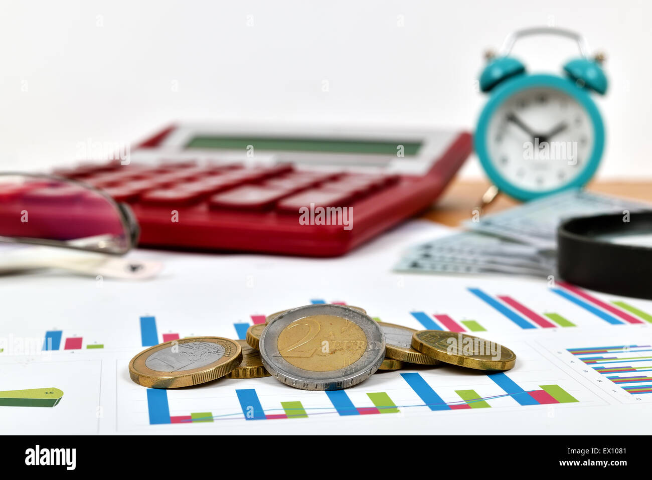 stack of euro coins on stock chart, close up Stock Photo