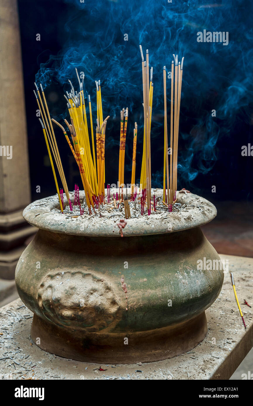 A lot of Incense sticks burning in a receptacle Stock Photo