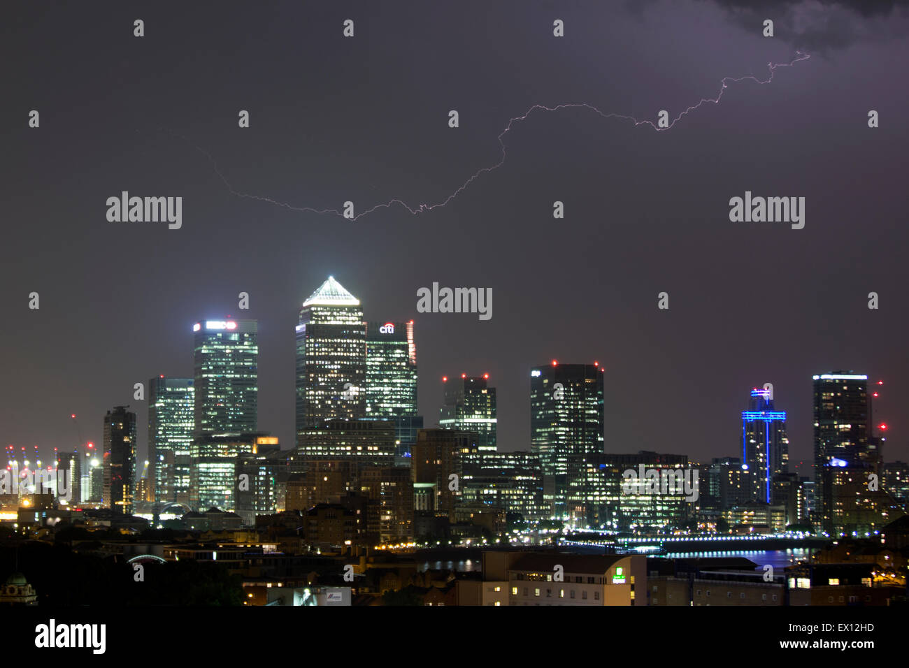 London, UK. 4th July, 2015. UK weather. Thunder Storm and lightning over Canary Wharf. Credit:  Simon Balson/Alamy Live News Stock Photo