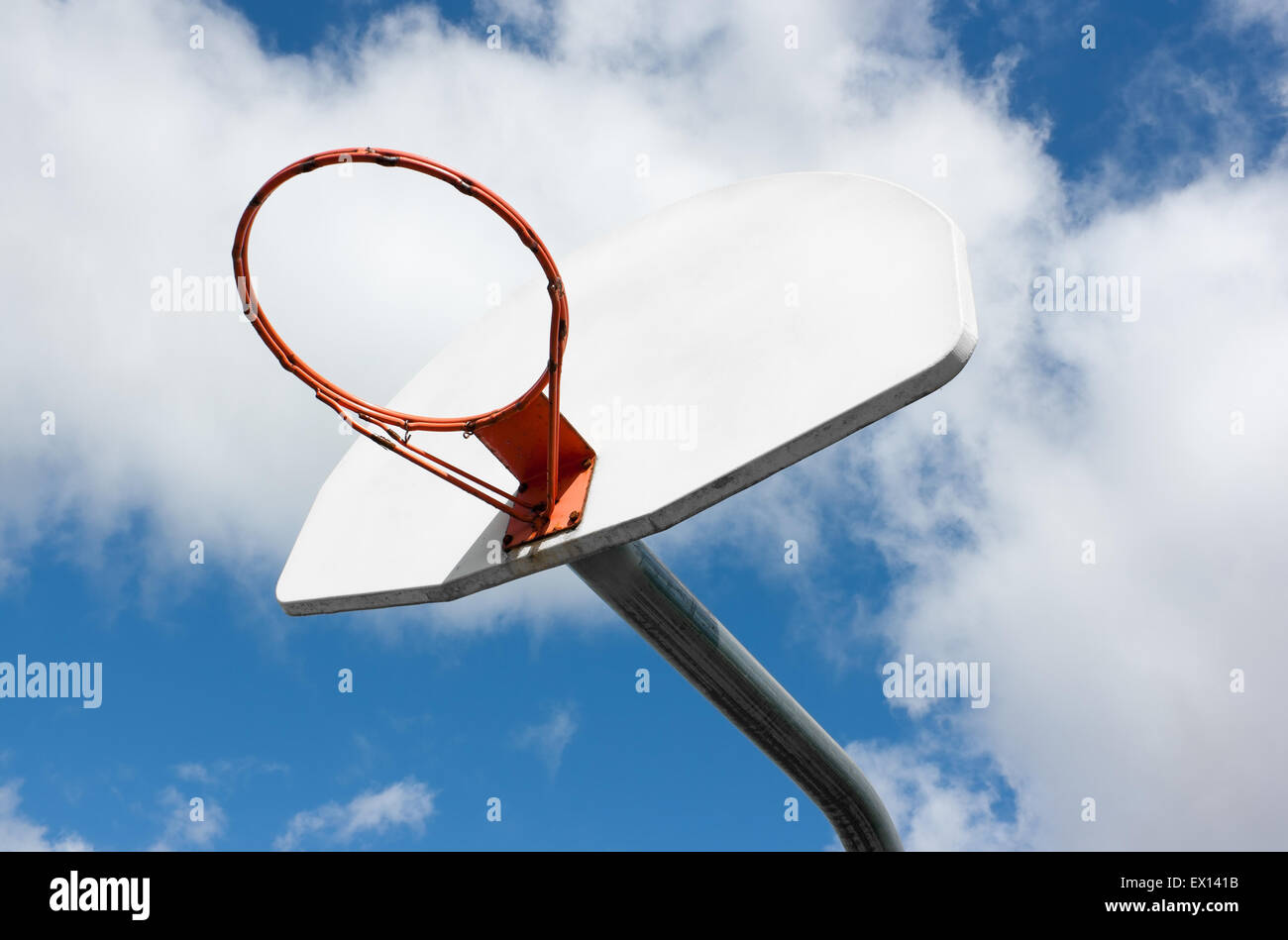 Outdoor basketball hoop and sky. Stock Photo