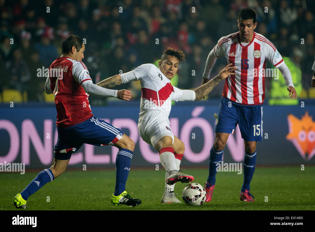 Concepcion, Chile. 3rd July, 2015. Peru's Jose Paolo Guerrero (C) vies with Paraguay's Pablo Aguilar (L) and Victor Caceres during the match for the Third Place of the America Cup Chile 2015, held in the Municipal Stadium 'Alcaldesa Ester Roa Rebolledo', in Concepcion, Chile, on July 3, 2015. Credit:  Pedro Mera/Xinhua/Alamy Live News Stock Photo