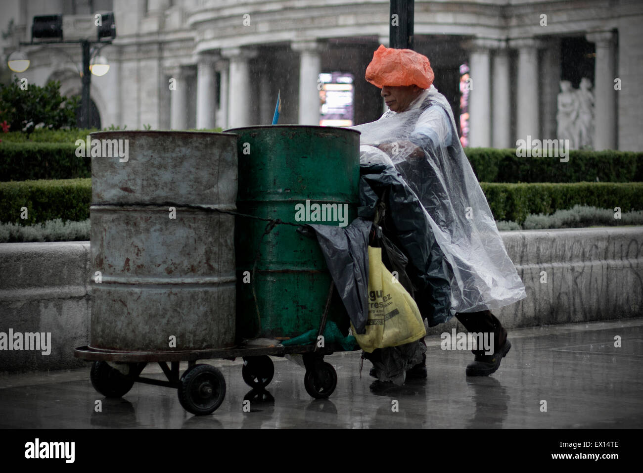 Mexico City, Mexico. 3rd July, 2015. A person walks in the rain in Mexico City, capital of