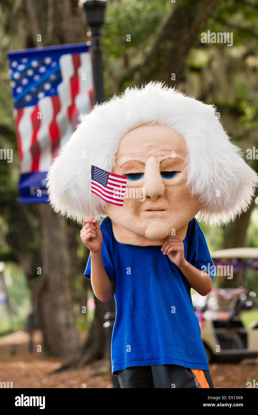 A child wearing a George Washington head watches the Daniel Island Independence Day parade July 3, 2015 in Charleston, South Carolina. Stock Photo