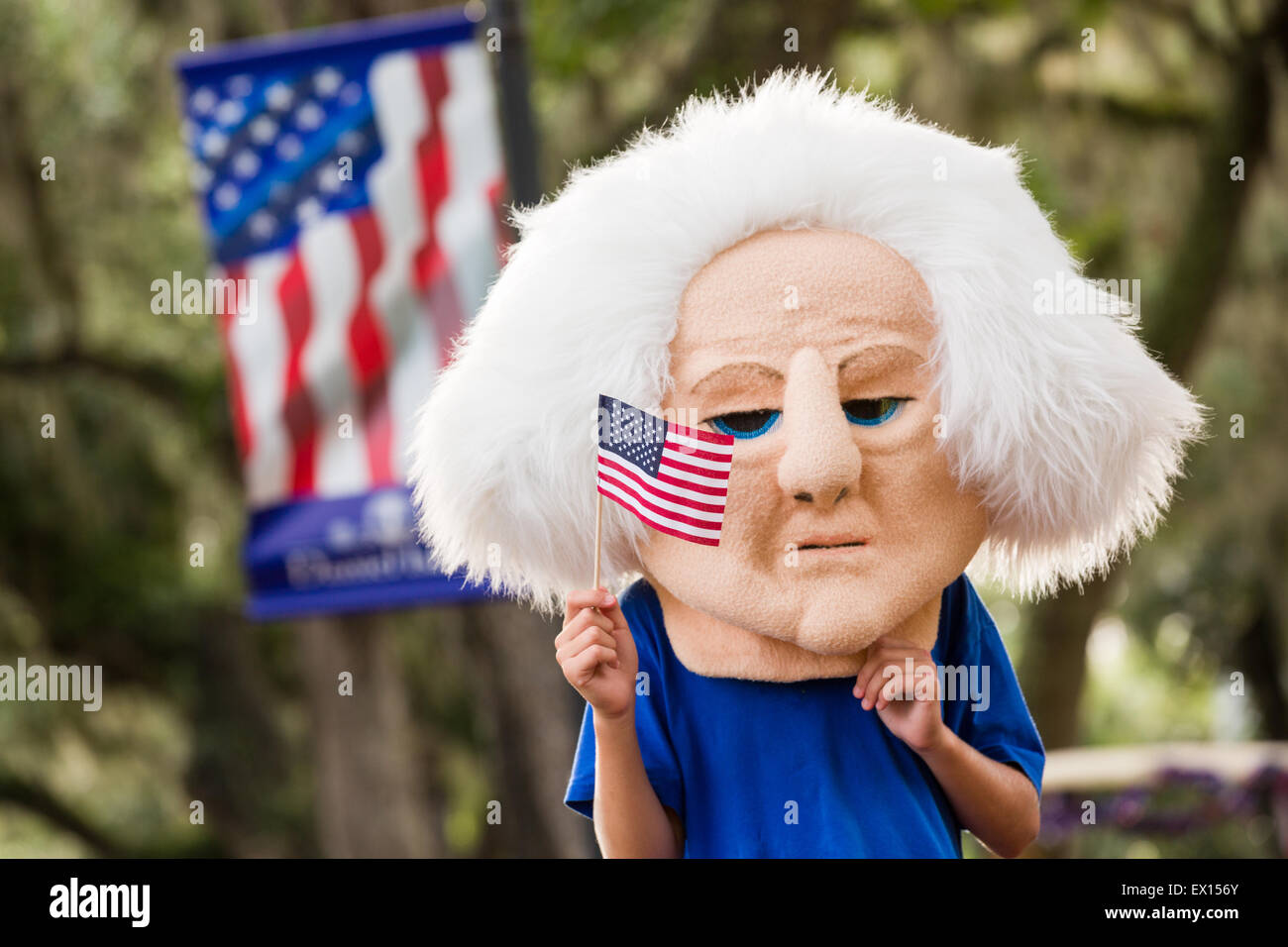 A child wearing a George Washington head watches the Daniel Island Independence Day parade July 3, 2015 in Charleston, South Carolina. Stock Photo