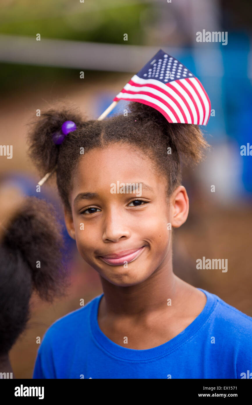 A young girl wears an American flag in her hair during the Daniel Island Independence Day parade July 3, 2015 in Charleston, South Carolina. Stock Photo