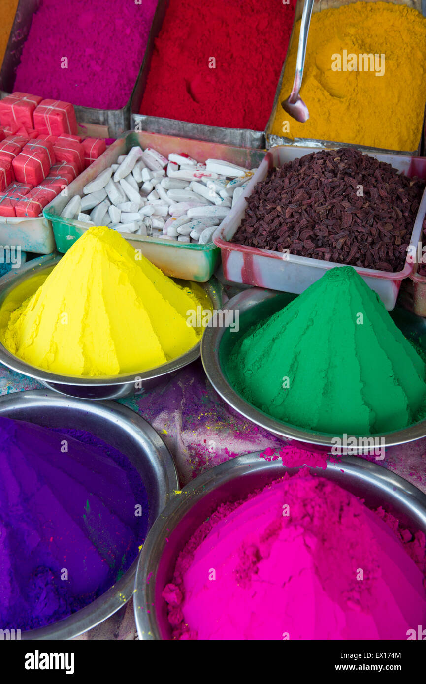 Sticker Colorful piles of holi powder dye at mysore market