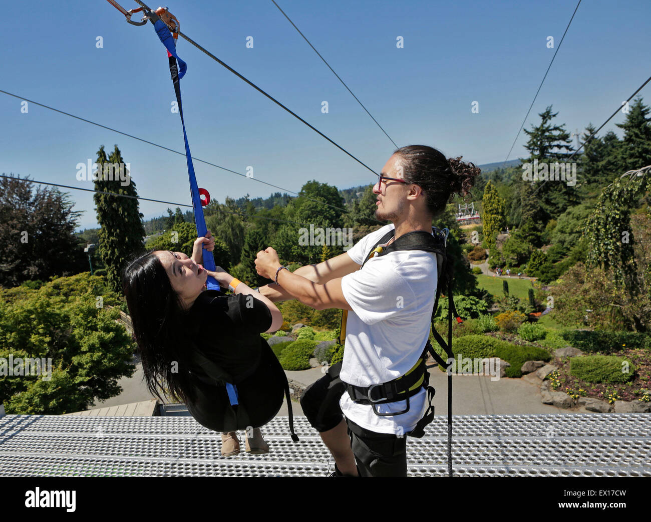 Vancouver, Canada. 3rd July, 2015. A rider gets ready to zip down the hill at the Queen Elizabeth Park in Vancouver, Canada, July 3, 2015. A new zipline was put into use at the Queen Elizabeth Park on Friday. Credit:  Liang Sen/Xinhua/Alamy Live News Stock Photo