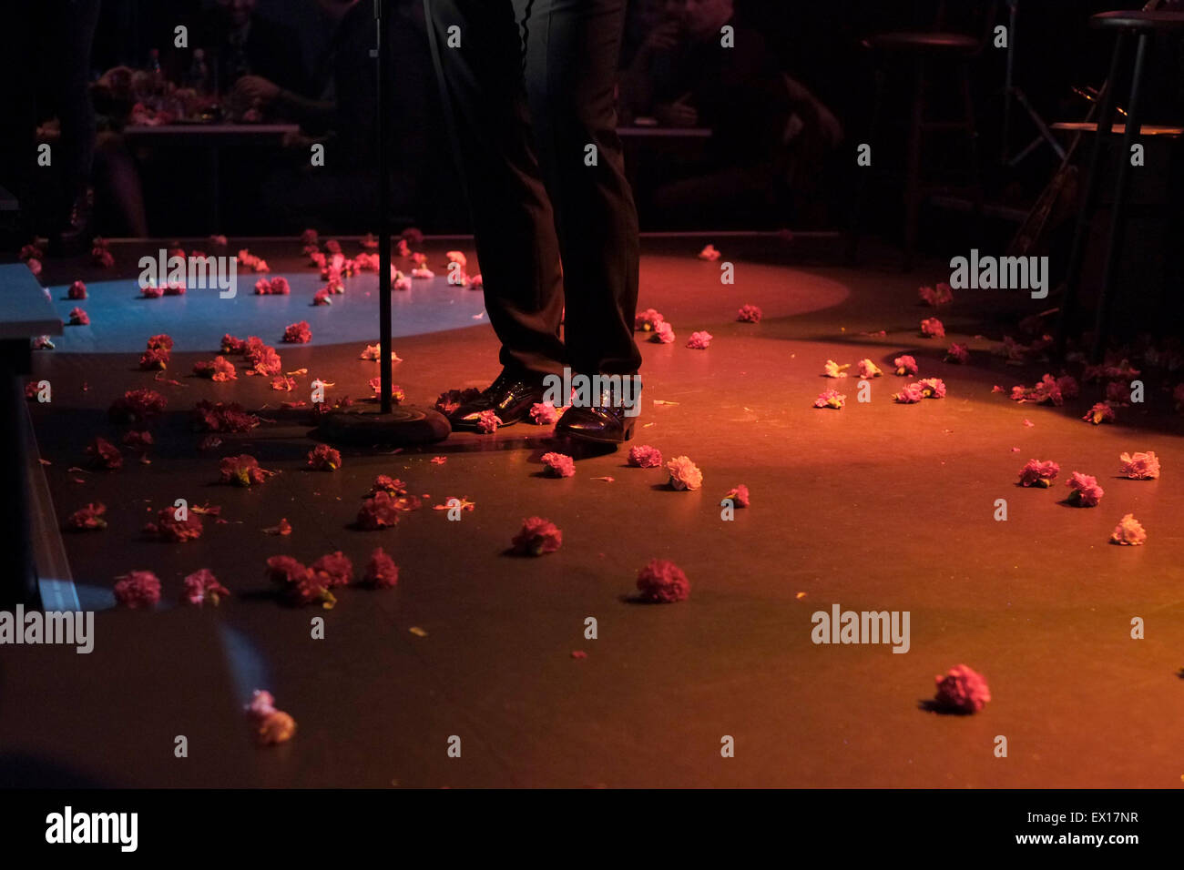 Rose flowers thrown at a Greek singer performing live during Rebetiko