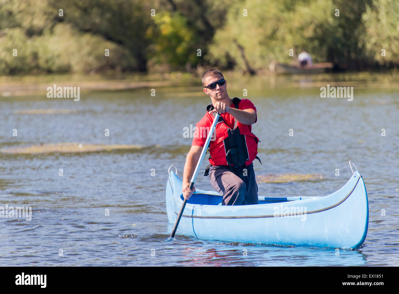 Young man in canoe Stock Photo Alamy