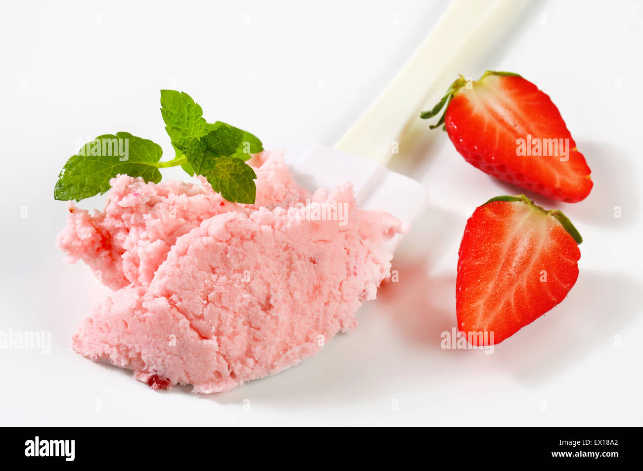 Strawberry ice cream on kitchen spatula Stock Photo