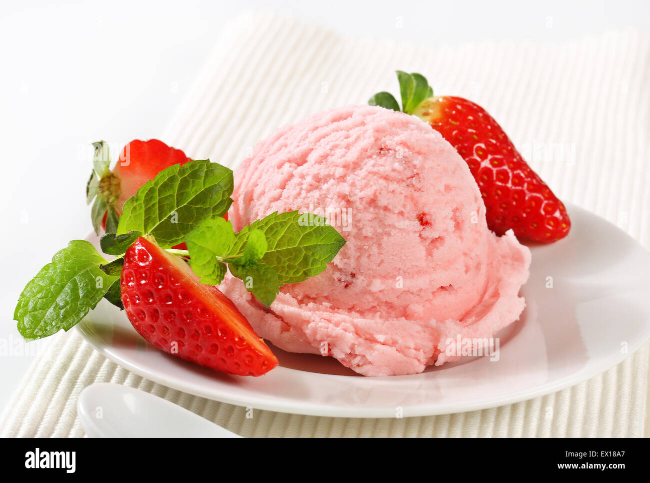 Scoop of ice cream with fresh strawberries Stock Photo