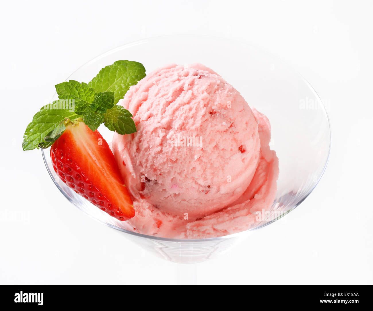 Scoop of strawberry ice cream  in stemmed glass Stock Photo