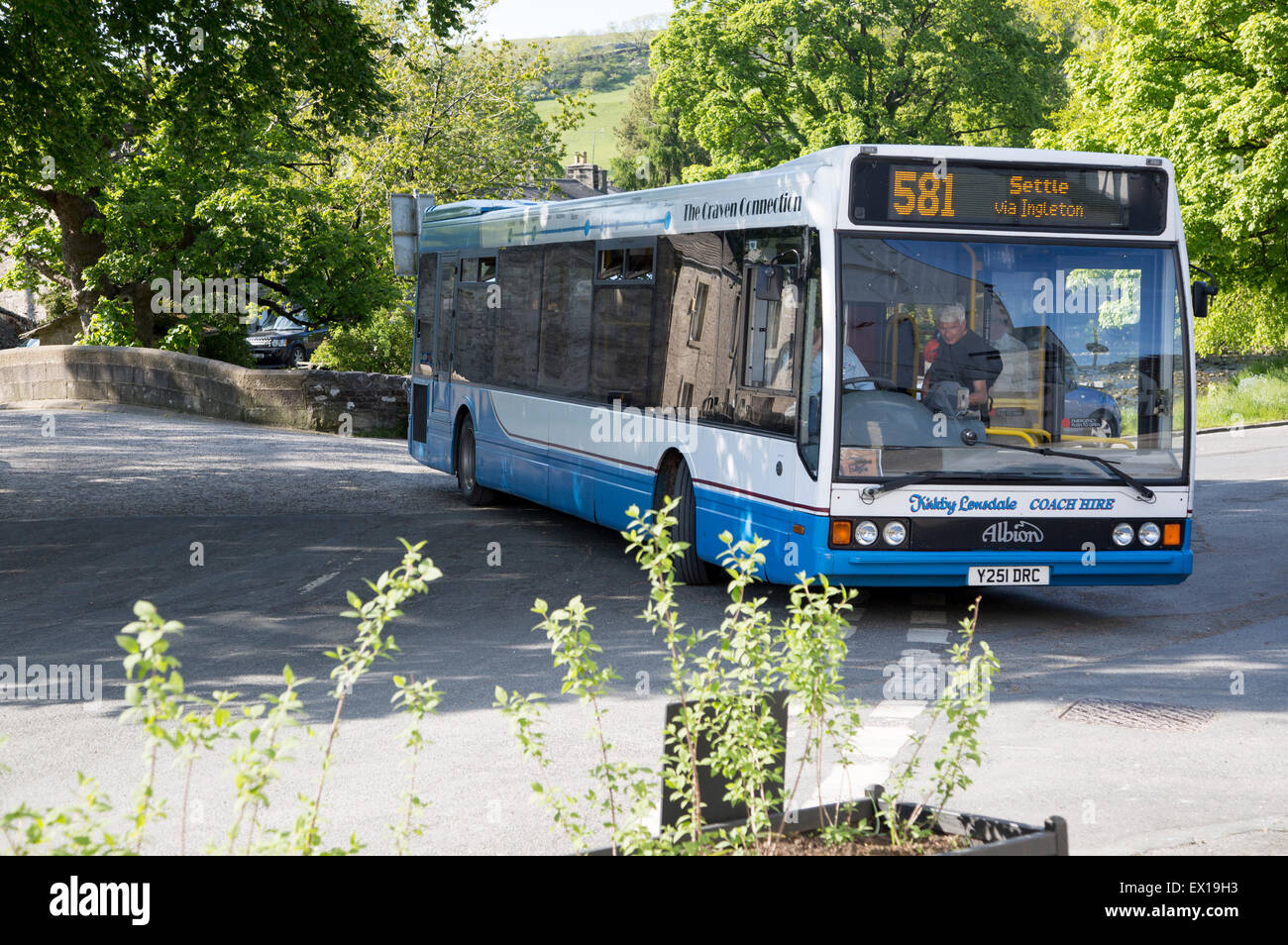 The Craven Connection public transport bus service, in Clapham village, Yorkshire Dales national park, England, UK Stock Photo