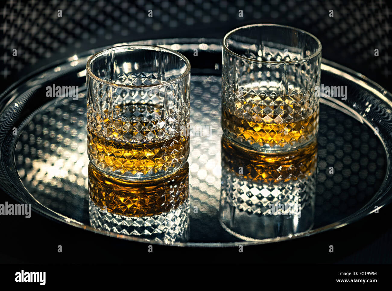 Whiskey glasses on the tray. Stock Photo
