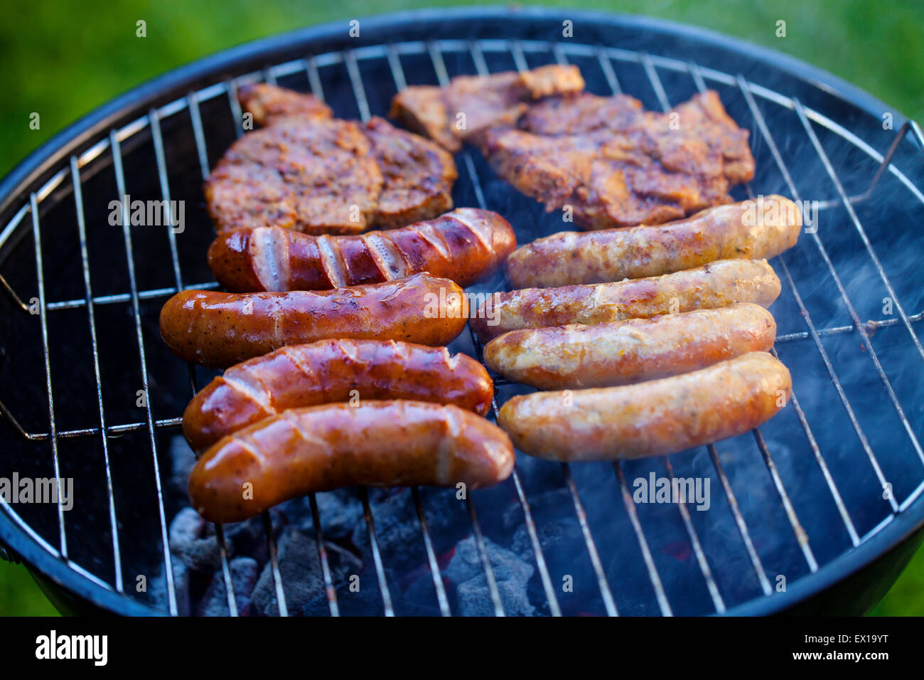 Sausages on barbecue Stock Photo