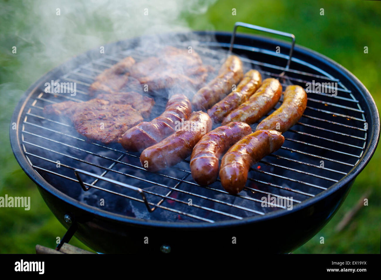 Sausages on barbecue Stock Photo