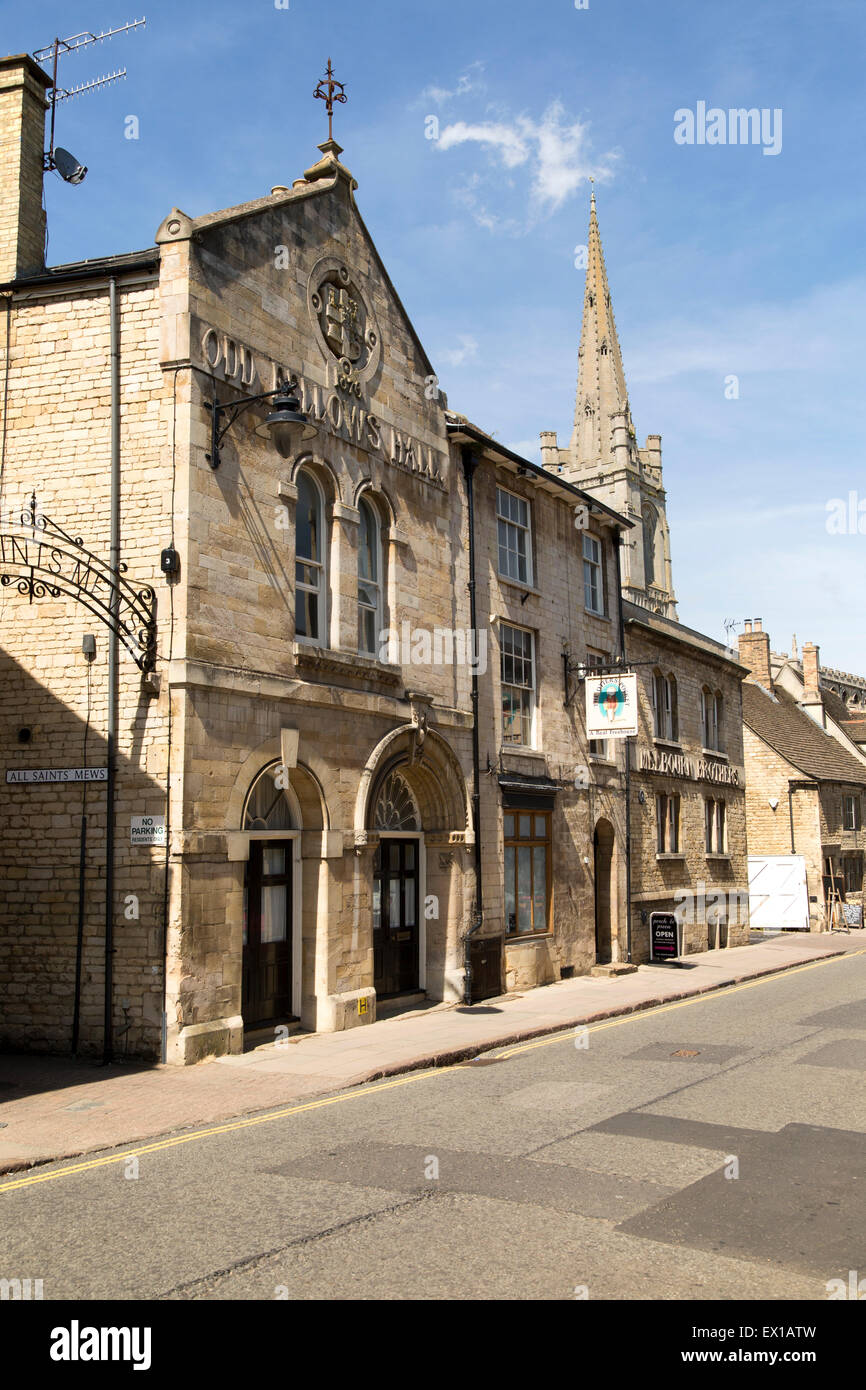 All Saints church spire and Old Fellows Hall,  Church Street, Stamford, Lincolnshire, England, UK Stock Photo