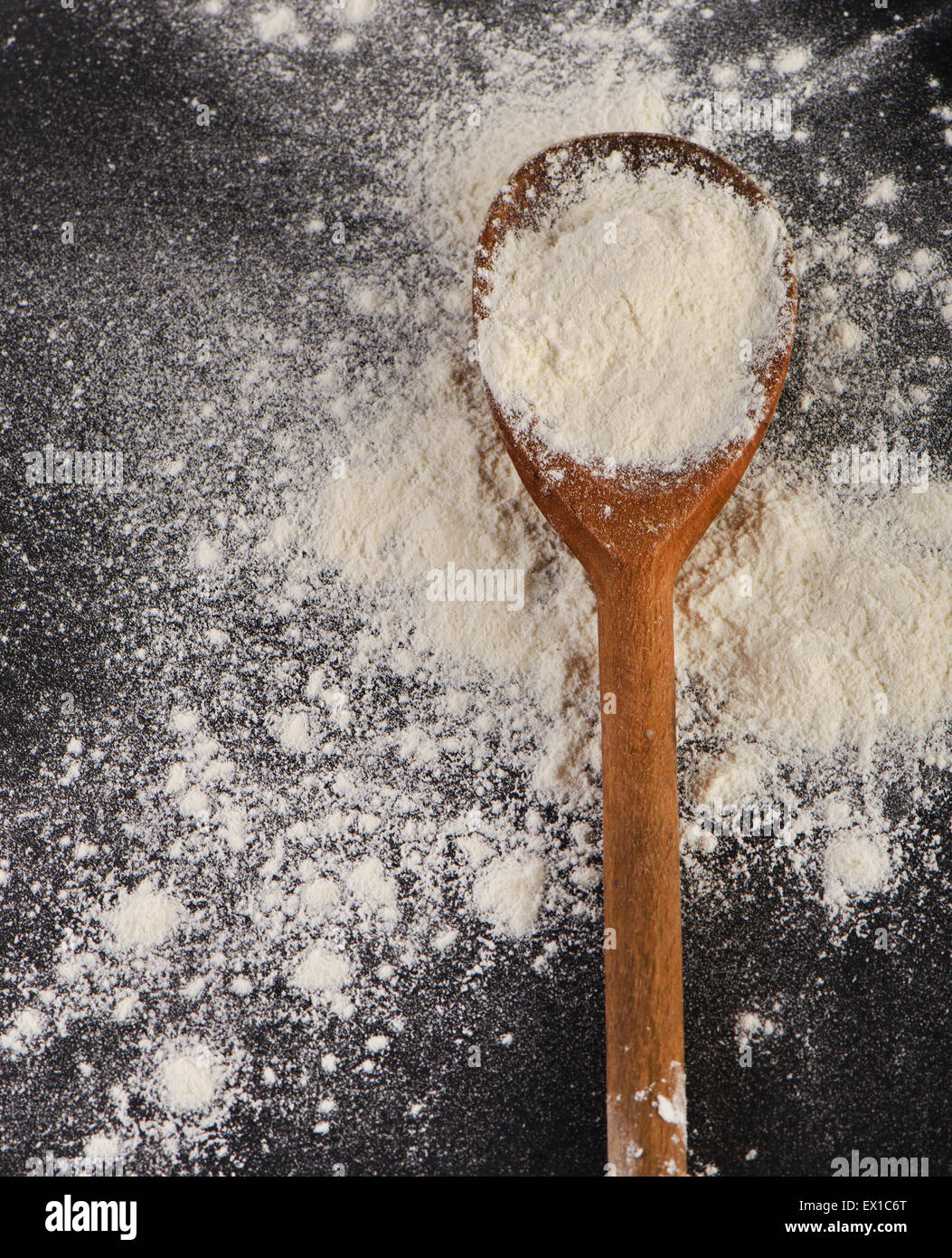 White Flour in a old wooden spoon. Top view Stock Photo - Alamy
