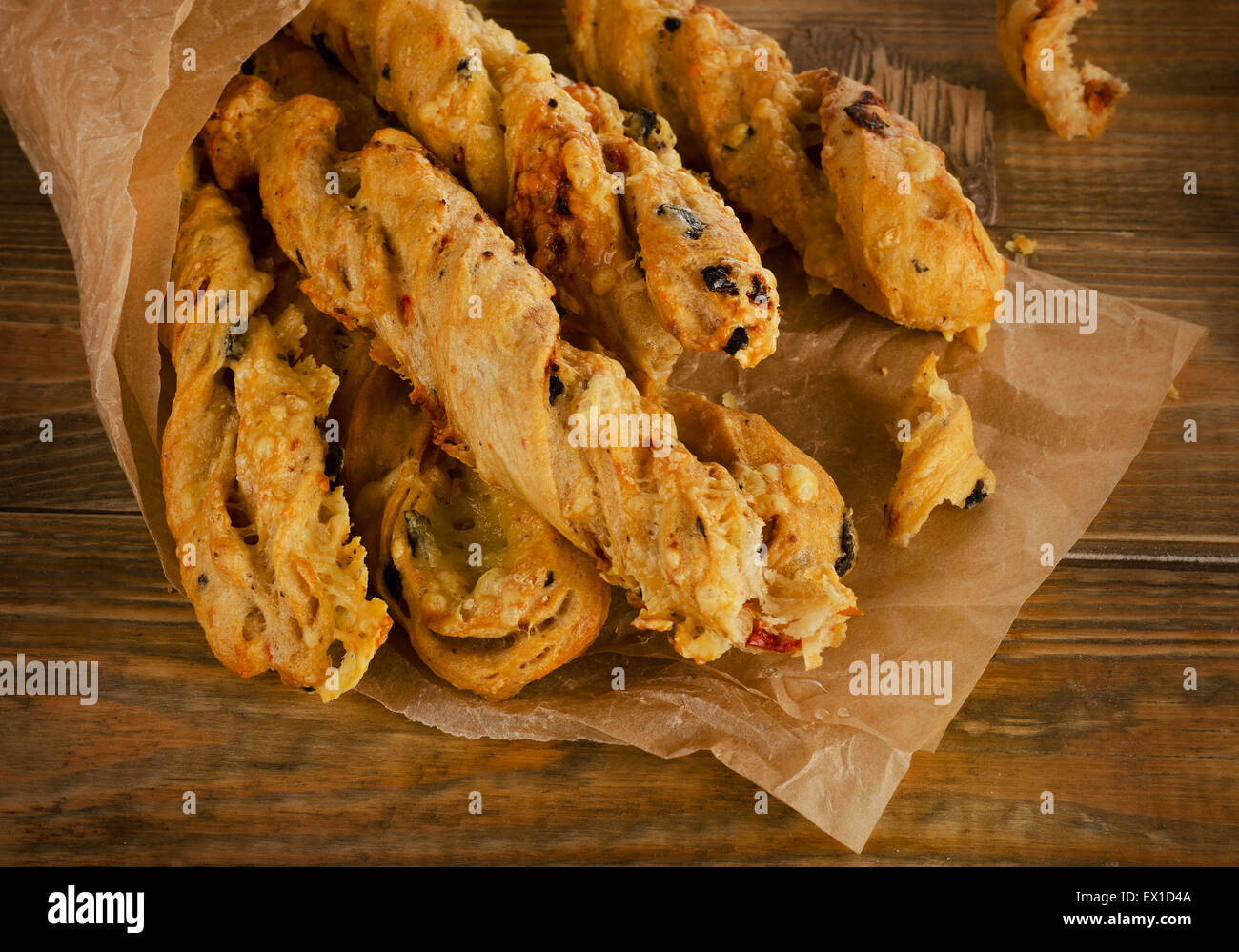 Homemade BreadSticks with cheese on a rustic wooden table. Selective focus Stock Photo