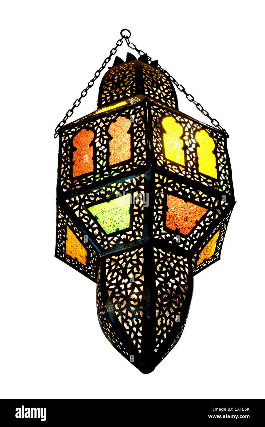Decorative chandelier made of black metal inlaid with colored glasses inserted in small windows Stock Photo