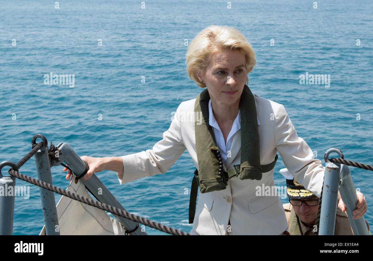 Sicily, Italy. 4th July, 2015. German Defence Minister Ursula von der Leyen (CDU) climbs aboard the frigate 'Schleswig-Holstein' during a visit to the 'Seenotrettung MED' (lit. sea rescue MED) Bundeswehr mission, off the coast of Sicily, Italy, 4 July 2015. Photo: SOEREN STACHE/DPA/Alamy Live News Stock Photo