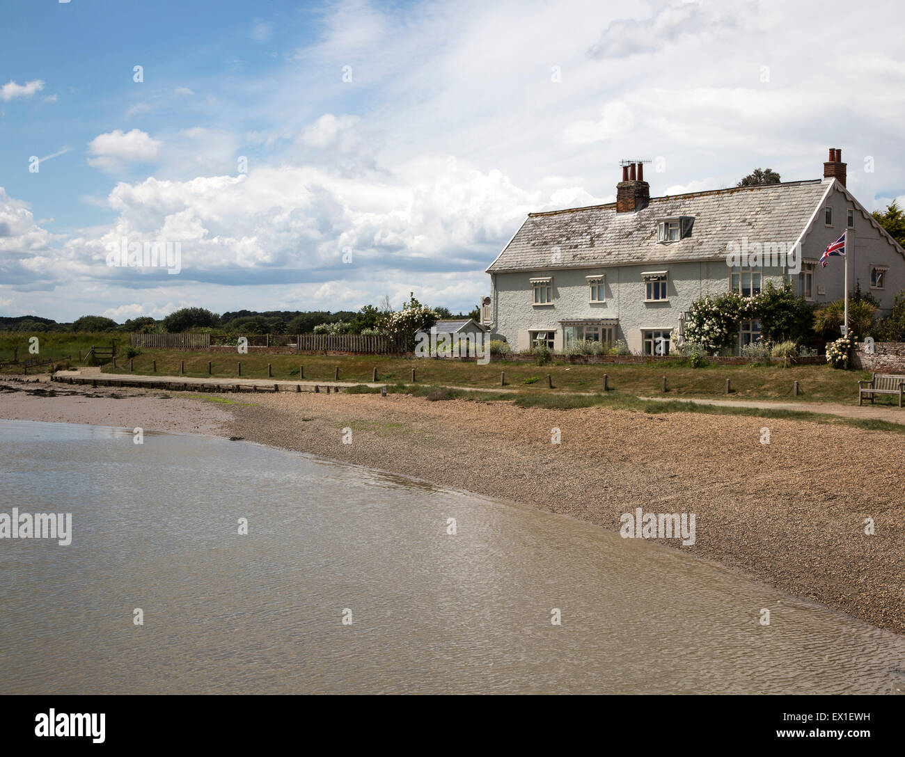 Waterside house by beach on the River Ore at Orford, Suffolk, England, UK Stock Photo