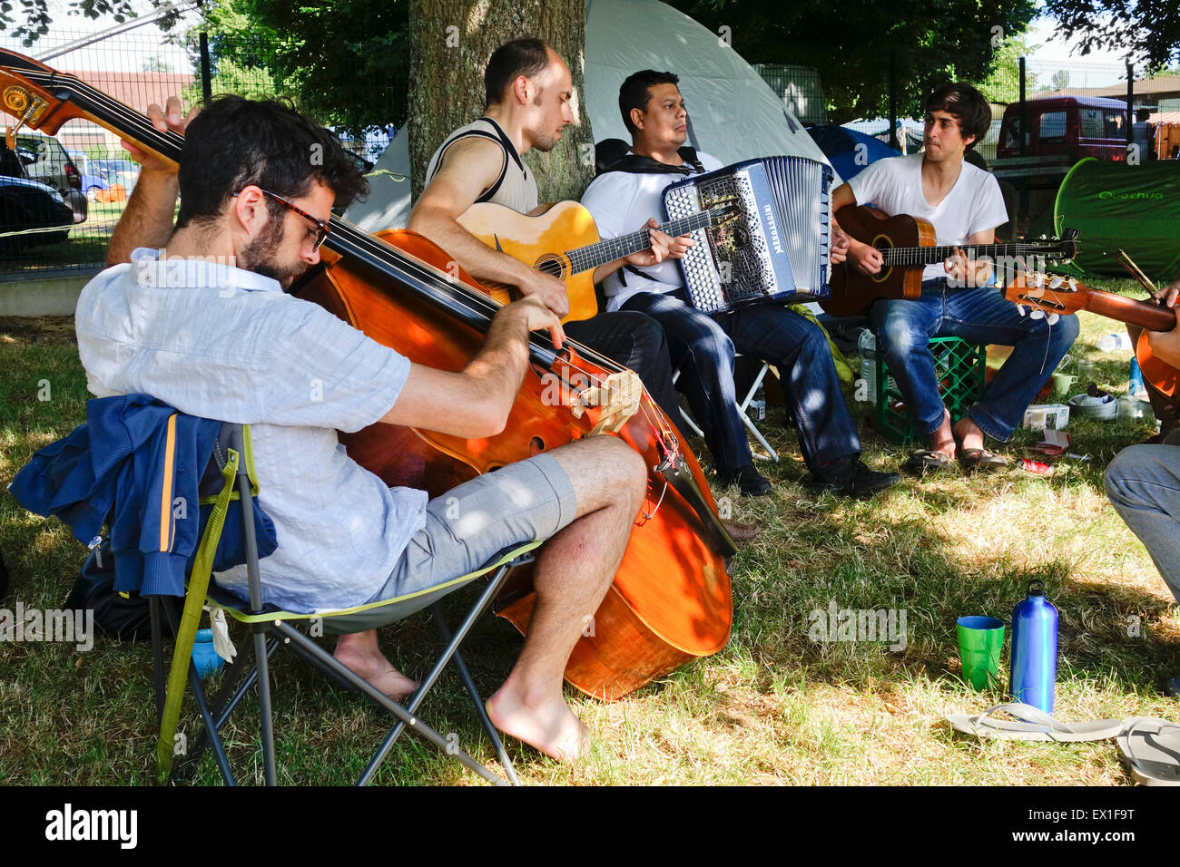 Gypsy jazz musicians jamming at campsites surrounding, Festival Django Reinhardt, Samois sur seine, France. Stock Photo