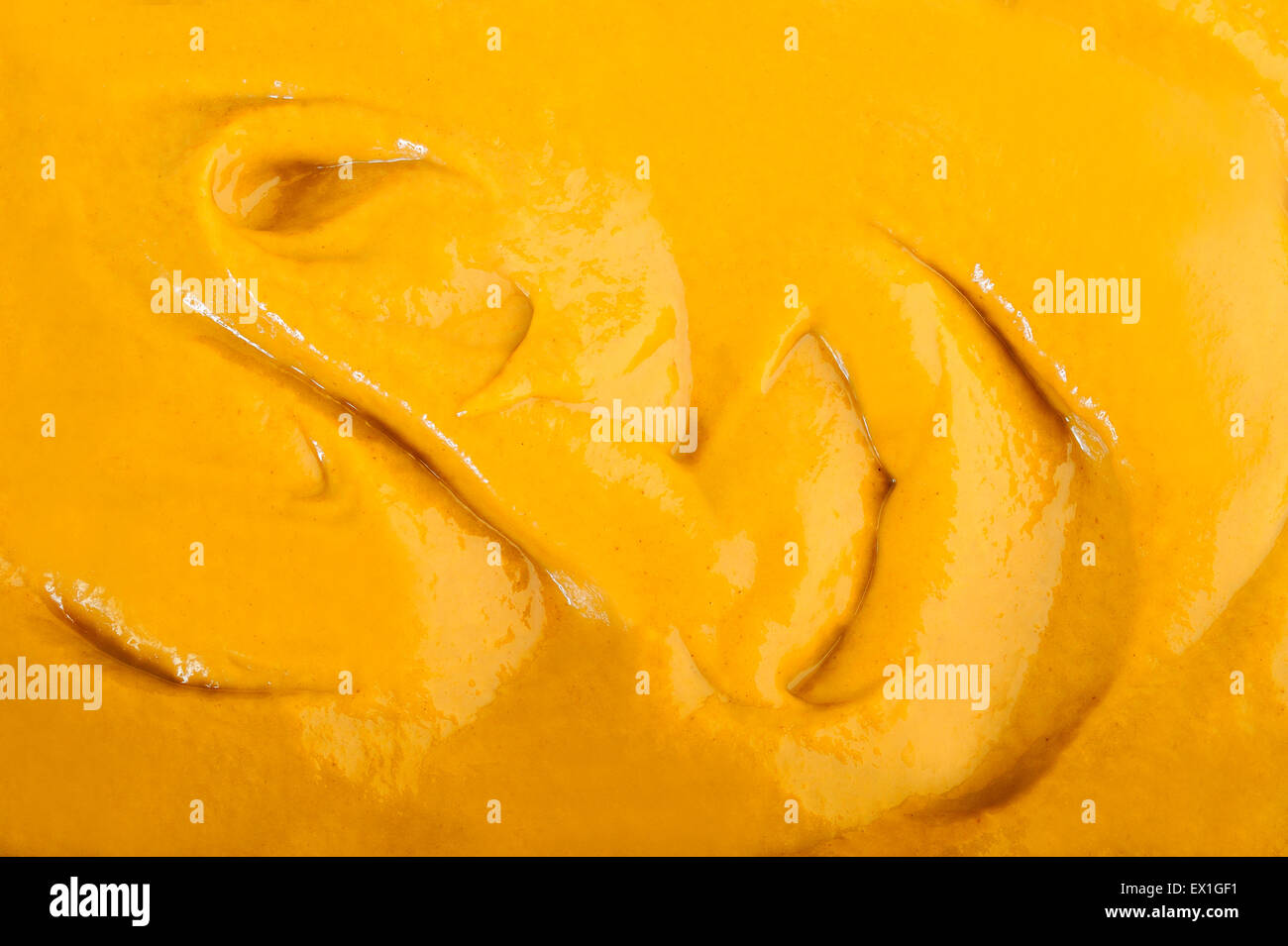 Mustard sauce background Stock Photo