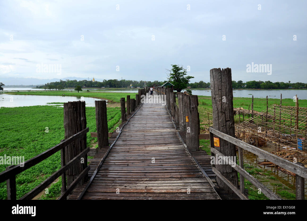 U Bein Bridge is a crossing that spans the Taungthaman Lake near ...
