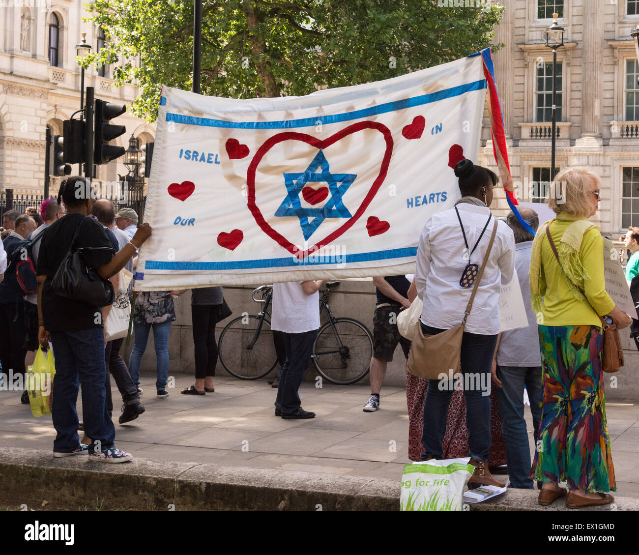 London, 04th July 2015. Anti-fascist protesters gather in Whitehall opposite Downing Street to oppose a Neo-Nazi protest dubbed 'Campaign 4 Truth'. The fascists original plan was to protest in the Jewish neighbourhood of Golders Green but the event was banned and moved to Whitehall outside Downing Street by the Metropolitan Police.  Credit:  Patricia Phillips/Alamy Live News Stock Photo