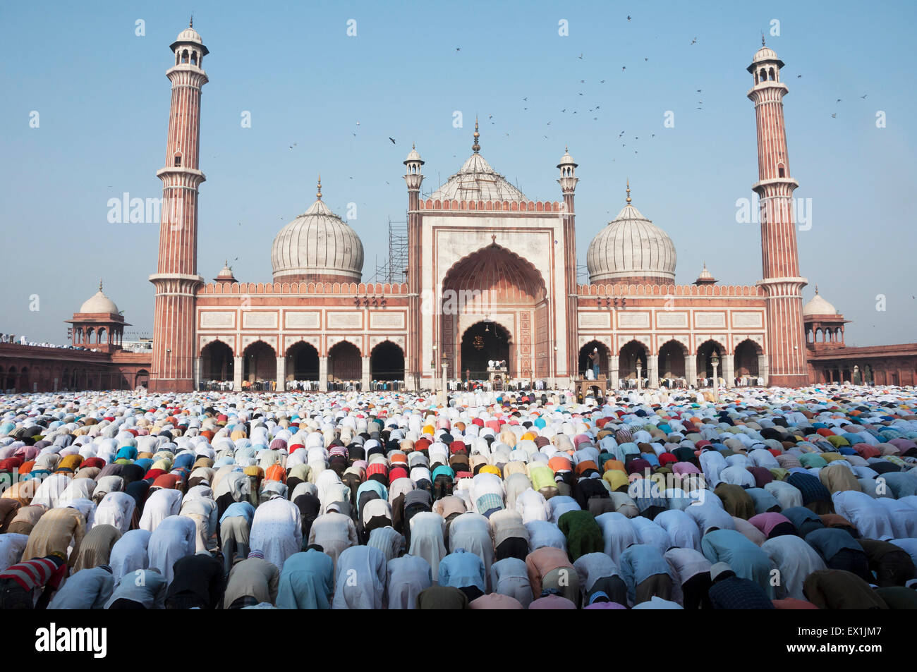 People offering prayers during the festival of Eid-ul-fitr at the Jama Masjid mosque in old Delhi, India. Stock Photo