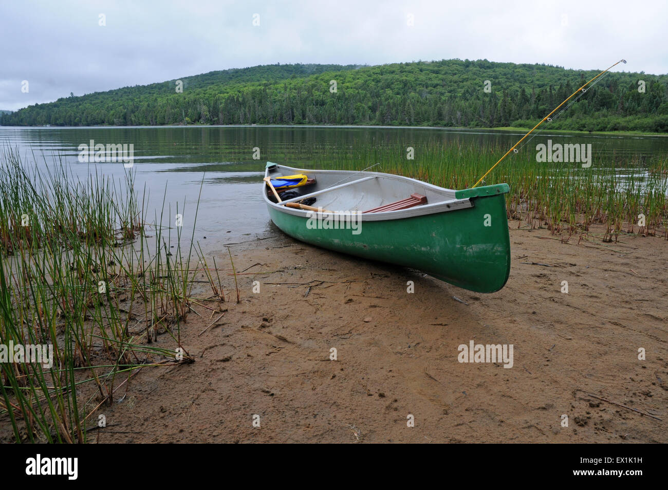 Canoe on edge of a lake Stock Photo