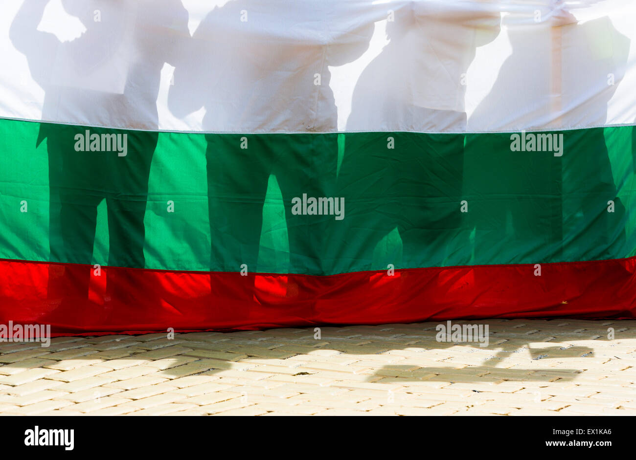 Bulgarians are protesting with the Bulgarian flag in front of them. Stock Photo