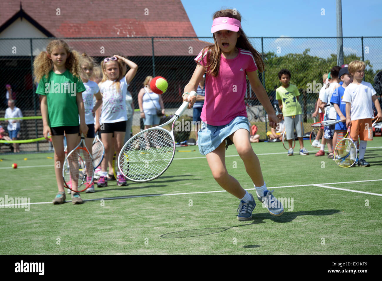 Kids line up to hit with British tennis stars in Wimbledon Park halfway